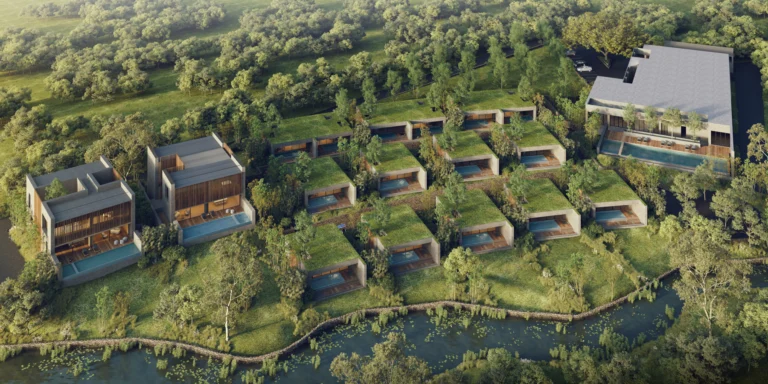 Aerial view of Nimman Khaoyai pool villas set along a canal with hills behind